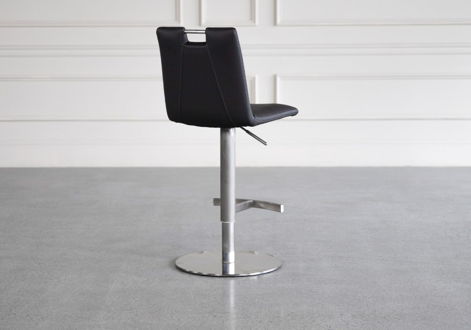 adele black vinyl swivel bar stool back