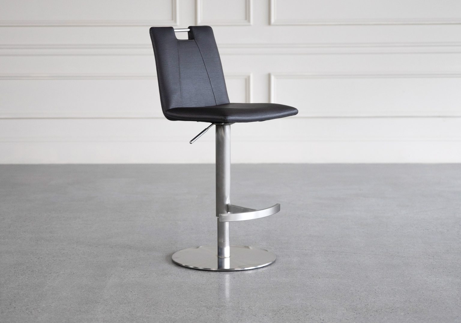 adele black vinyl swivel bar stool featured