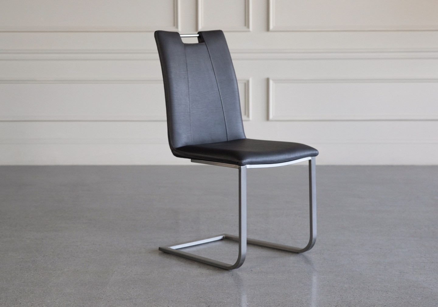 marta vinyl dining chair black angle