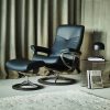 Stressless Dover Signature Recliner and Ottoman in Paloma Black Leather and Wenge Wood Base in a Living Room