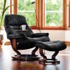 Stressless Sunrise Classic Recliner and Ottoman in Paloma Black with a Walnut Base and Swing Table