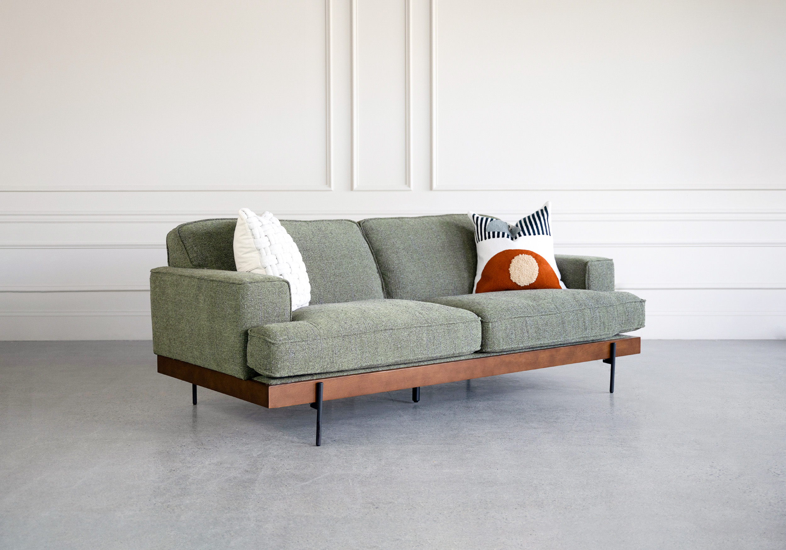 clint fabric sofa angle with pillows